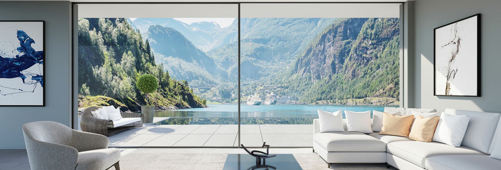 Indoor view of a bright living room, looking out on a vast lake thanks to our HiFinity sliding solution.