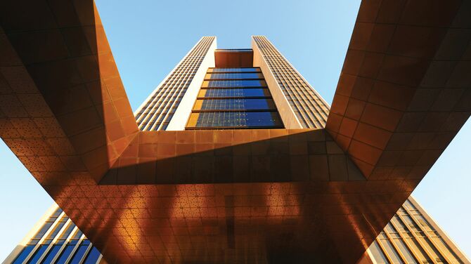 Close up of the bronze Four Seasons Hotel tower in Bahrain.