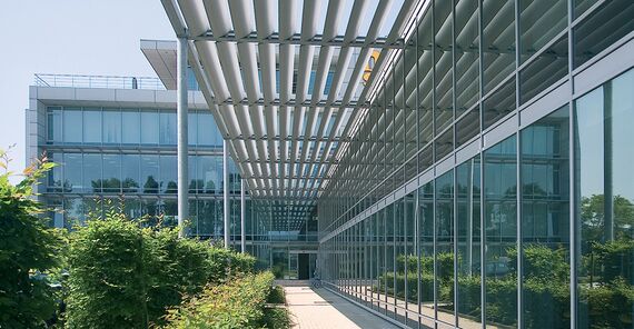 BriseSoleil solar shading outside a glass-and-aluminium office complex.